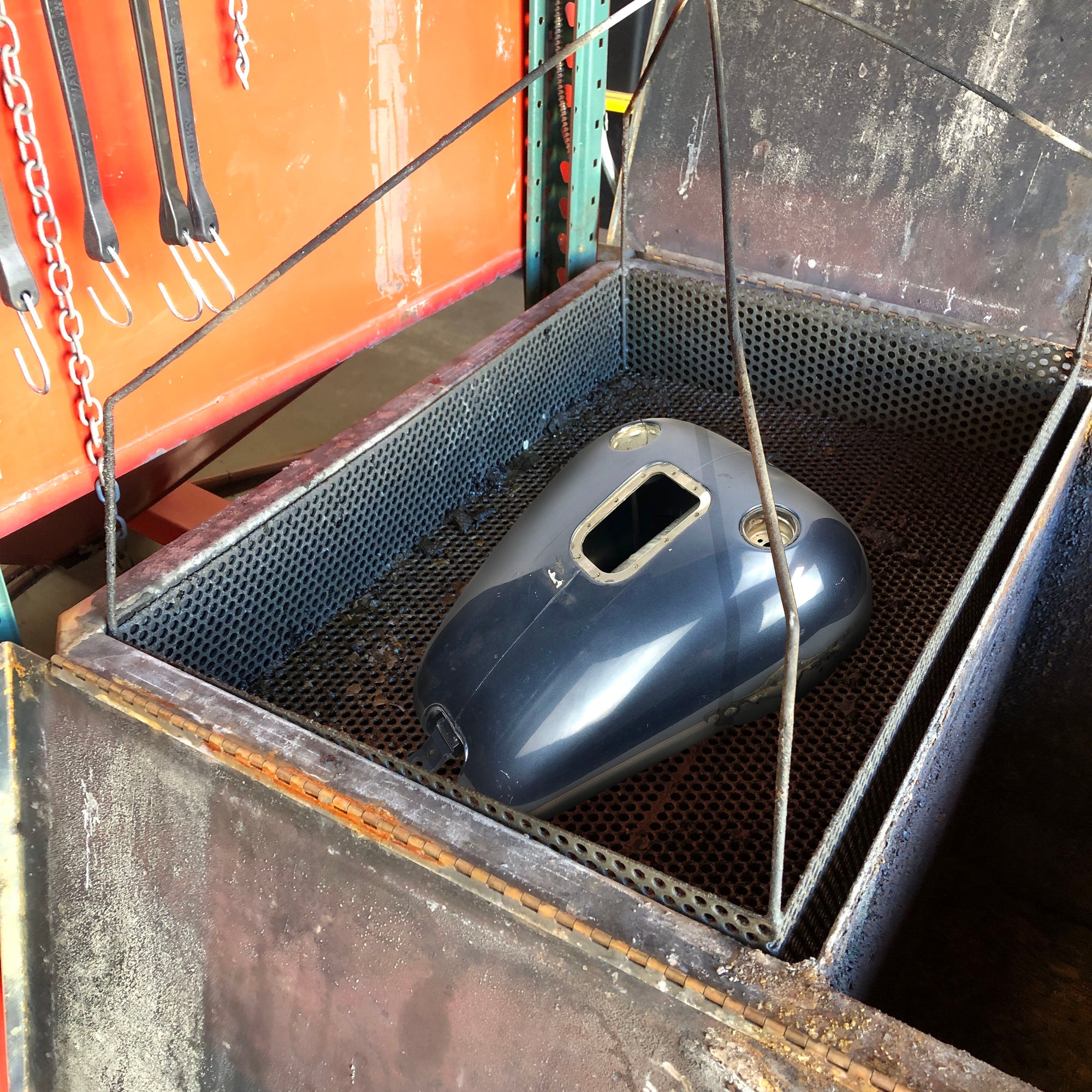 Removing failed tank liner inside Harley Davidson gas tank.